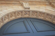 Facade of a stoned entrance in French Bordeaux city