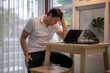 © Wasana - Stressed asian freelancer having problems working from home office