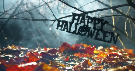 Wall Mural - Happy Halloween text hanging in mysterious wilderness at midnight covered in dense fog. Dramatic smoky atmosphere effect around bare branches in a deserted woodland for spooky Halloween background.