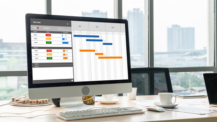 Wall Mural - Project planning software for modish business project management on the computer screen showing timeline chart of the team project