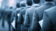 © kaliel - Business queue of job applicants holding documents representing hiring selection and competitive recruitment process for human resources and corporate careers