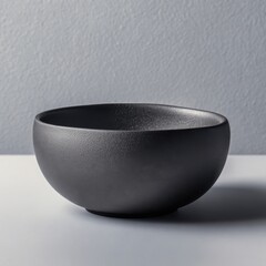 Wall Mural - Matte Black Ceramic Bowl on Neutral Background for Modern Decor