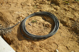 coil of cable abandoned on the ground