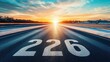 © zohaib - Road with number 226 painted on the asphalt leading to the horizon at sunrise in the morning