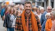 © liliyabatyrova - Male model showcases stylish autumn layered outfit during outdoor fashion event in a bustling city street