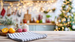 © M - Cozy kitchen scene with holiday decorations, fresh lemons, and herbs on a wooden surface with a soft bokeh background