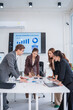 © aekachai - Professional Business Women Analyzing Financial Reports in Modern Office