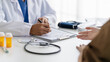 © mojo_cp - doctor consults with a patient during a medical examination in a clinic