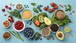 © Anatolii - Vibrant display of healthy food choices featuring fruits, seeds, and grains arranged on a blue surface