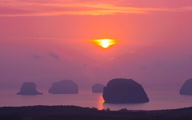 Wall Mural - 
Scenery High peaks wonderful pink sky at sunrise above Samed Nang Chee viewpoint in Phang Nga. 
tropical landscape background.
scenery romantic sky of sweet sunrise above Samet Nangshe Islands.
