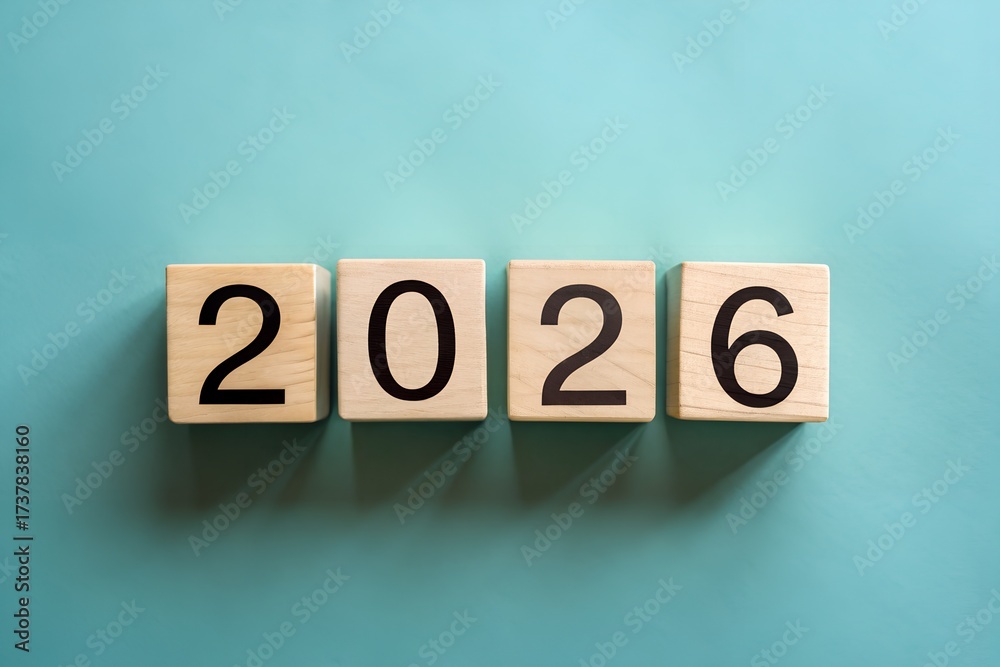 Four wooden letter blocks spelling out the year 2026 arranged on a ...