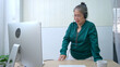 © Wosunan - On a holiday, an elderly woman is giving online advice and counseling
