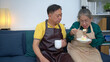 © Wosunan - On a holiday, an elderly couple tests out handmade desserts at home.