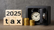 © osagvsa - Tax 2025 deadline concept with clock in safe and stacked gold coin