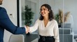 © DFN99 - Businesswoman Shaking Hands With Male Colleague in Modern Office, Positive First Impression with Successful Business Partnership in Corporate Environment