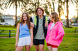 © Austockphoto - Group of young people socialising and having fun in a park on a warm evening
