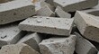 © Photyn Studio - A pile of old concrete pavers are salvaged from demolition to be reused or recycled. Concept of recycling construction and demolition waste.