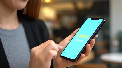 Woman using smartphone interface displaying five star review