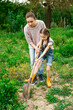 © jutaphoto - Mother and daughter working in the garden