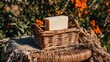 © arie - Light-colored bar of soap in a woven basket outdoors.