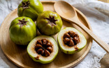 Fresh Kokum (Garcinia Indica) Fruit Sliced on a Wooden Plate