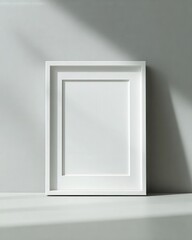 Wall Mural - Empty Simple White Wooden Frame Leaning Against Light Wall