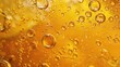 © Hafiz - Close up shot of golden liquid with bubbles floating and clinging to the side of the glass container