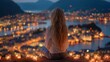 © nur khayati w - Woman meditates, back facing, overlooking city lights at dusk, surrounded by candles