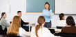 © JackF - Confident young female professor talks to students in classroom