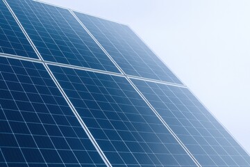 close-up of solar panel array under a clear sky, sustainable energy generation concept