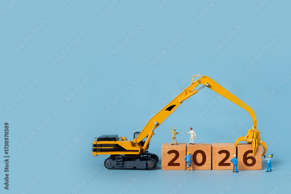 Transitioning from 2025 to 2026 with wooden blocks and miniature ...
