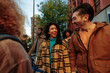 © bernardbodo - Group of young tourists walking down the street and having fun