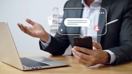 Businessman using smartphone with message bubble, social media communication concept, technology and business communication