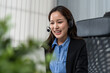 © Kawee - Asian beautiful businesswoman call center working in office corporate.