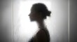 © Helmalia - Silhouette of a woman's profile seen through a steamy, wet glass surface.