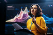 © Konstantin Yuganov - woman is giving a presentation at conference