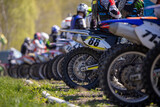 View rear wheels of motocross motorcycles standing on starting line