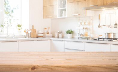 Wall Mural - Food presentation background with empty wooden table top in front of blurred modern kitchen workspace interior