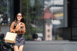 © crizzystudio - Young asian woman enjoying urban shopping experience