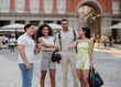 © PintoArt - Diverse group of friends traveling in city plaza