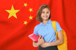 © New Africa - Happy student with backpack and notebook against flag of China. Language school