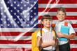 © New Africa - Children with backpacks and notebooks against flag of USA. Language school