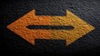 © Sarti - Close-up shot of an arrow sign on a dark textured surface, pointing in two directions