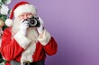 © dashtik - Santa claus taking photos with a camera in festive setting