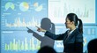© abdelaziz@771 - Confident businesswoman expertly presenting financial data and growth charts on a large projection screen to an engaged audience