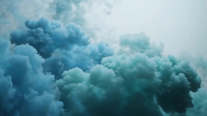 Wall Mural - Blue and teal smoke billowing in the air, creating an abstract and ethereal scene.