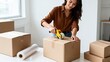 © cong - Woman packing boxes with tape