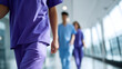 © Sergio IQstock - Healthcare professionals in scrubs walking in hospital, teamwork in modern medicine healthcare professionals scrubs, hospital teamwork, doctors nurses walking, medical staff corrid