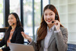 © David - Diverse group of people work at call center or helpful customer service. Attractive women uses pc computer and monitor at busy agency office closeup. Phone talk and answer questions on modern hotline