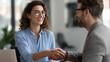 © Kateryna - Joyful happy female professional exchanging celebratory handshake with businessman after successfully finalizing business agreement during office meeting business agreement
